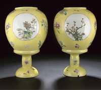 early 20th century A pair of famille rose yellow ground globular lanterns and stands